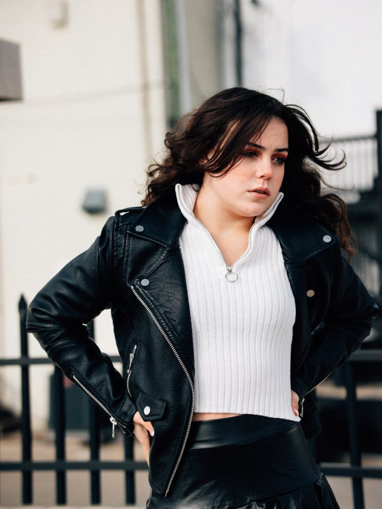 A woman in a leather skirt and a black jacket